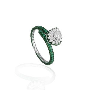 Emerald and diamond floral ring with a large central diamond cluster mounted on a green gemstone band.