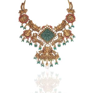 Gold statement necklace by Ananth Diamonds with carved motifs, central emerald stone and detailed gold scrollwork on mint green background