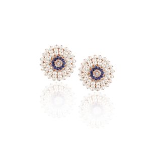 Round pearl and blue sapphire cluster stud earrings with diamond accents set in rose gold.