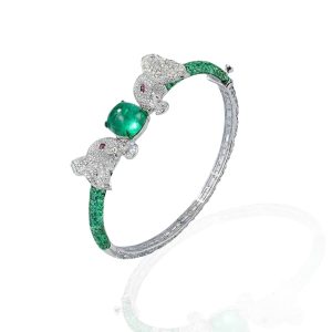 Emerald and diamond elephant bracelet by Anmol Accents with twin diamond elephant heads and a vivid green centre stone.