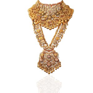 Grand antique gold layered necklace displayed on dark green stand