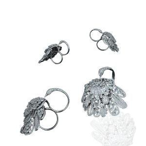 Diamond peacock inspired statement ring with layered feather detailing in white gold.