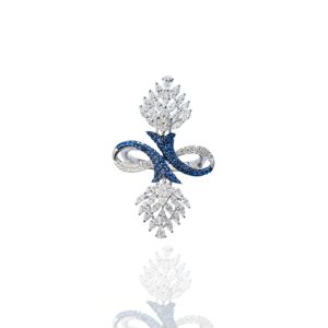 Statement diamond ring with blue gemstone detailing in a sculpted infinity-inspired design.