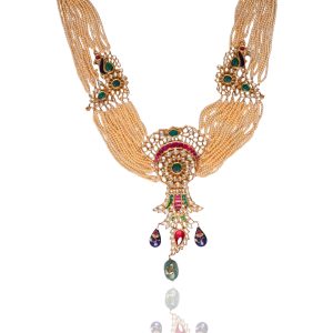 Multi layer pearl and polki necklace with emerald and ruby details by Nagi Diamond Jewellers on a white background.