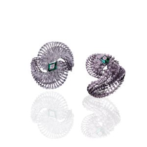 Spiral diamond bracelet with layered baguette and round diamonds and green centre stone in white gold