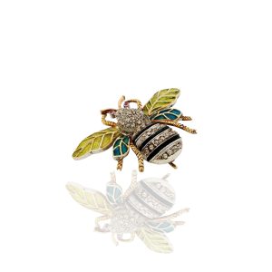 Diamond and enamel bee brooch with green and blue wings, gold detailing and sparkling diamond body.