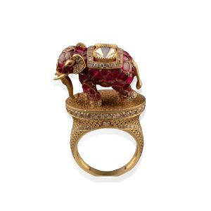 Ruby enamel elephant cocktail ring by Madanlal Chhaganlal Jewellers with diamond detailing and ornate gold craftsmanship.