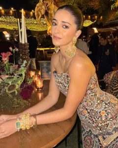 Ananya Panday wearing handcrafted chandelier earrings and gemstone bangles by Jagdish Jewellers at an evening celebration.