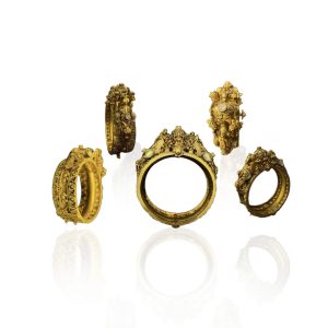 Sculptural antique gold bangles with intricate carvings by PB Society Jewellers.