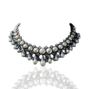 Basra pearl collar necklace with diamond detailing displayed on a dark blue mannequin by Sanjay Gupta World.