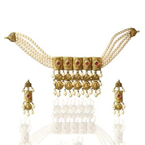 Temple style gold necklace with pearl strands and ruby detailing by Shyam Sundar Co. Jewellers with matching earrings.