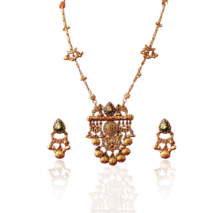 Gold necklace with pendant and earrings featuring traditional motifs by Pooja Diamonds.