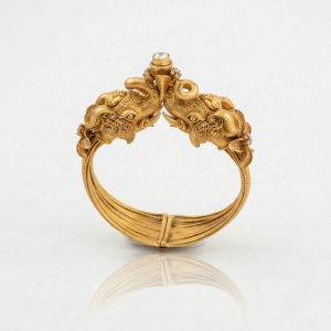 Sculptural temple inspired gold cuff bracelet with intricate motifs from AJB Fine Jewels’ latest jewellery collection.
