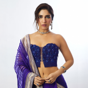 Bhumi Pednekar wearing diamond choker, earrings and cuffs by Mahesh Notandass with a blue saree.