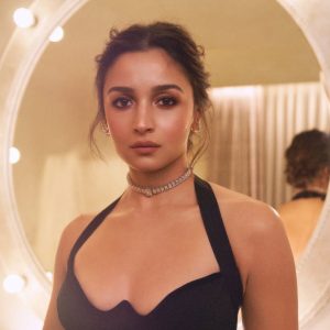 Alia Bhatt wearing delicate diamond choker by Mahesh Notandass in warm lighting