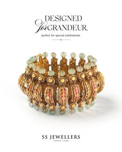Antique gold bangle with carved panels and green bead drops by SS Jewellers