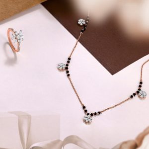 Designer mangalsutra with spaced motifs by Neelkanth Jewellers