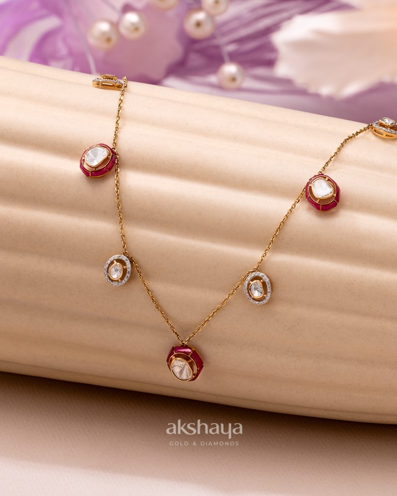 Lock motif gold earrings by Farah Khan World with layered gemstone necklace by Akshaya Gold and Diamonds