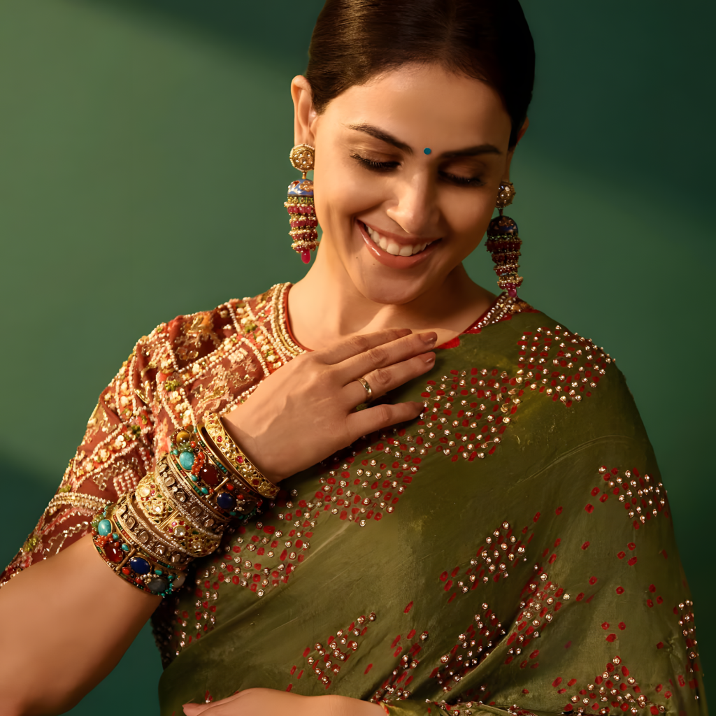 Genelia D’Souza wearing stacked multicolour gemstone bangles by Jagdish Jewellers