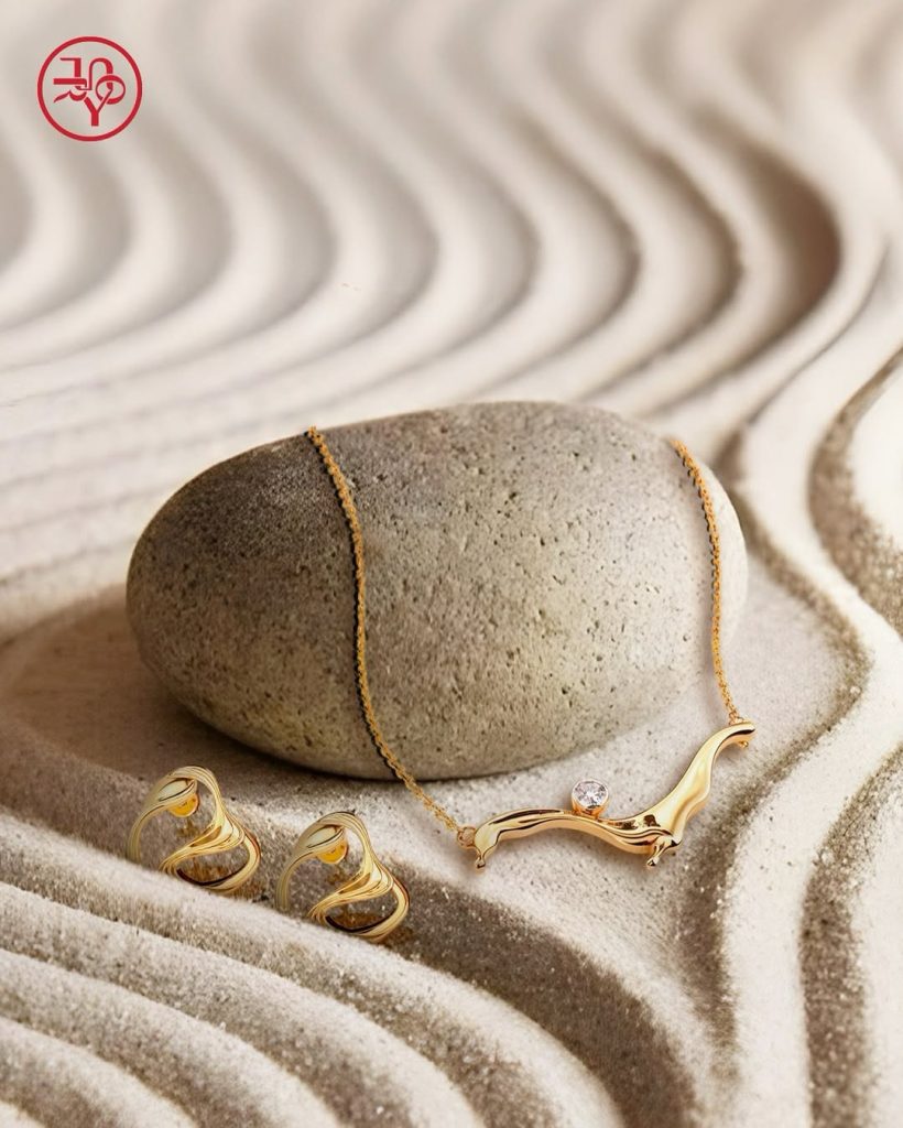 Geometric diamond earrings by Irasva Fine Jewellery and bold gold statement earrings by Youlry