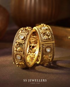 Intricately carved gold kada with detailed craftsmanship by SS Jewellers