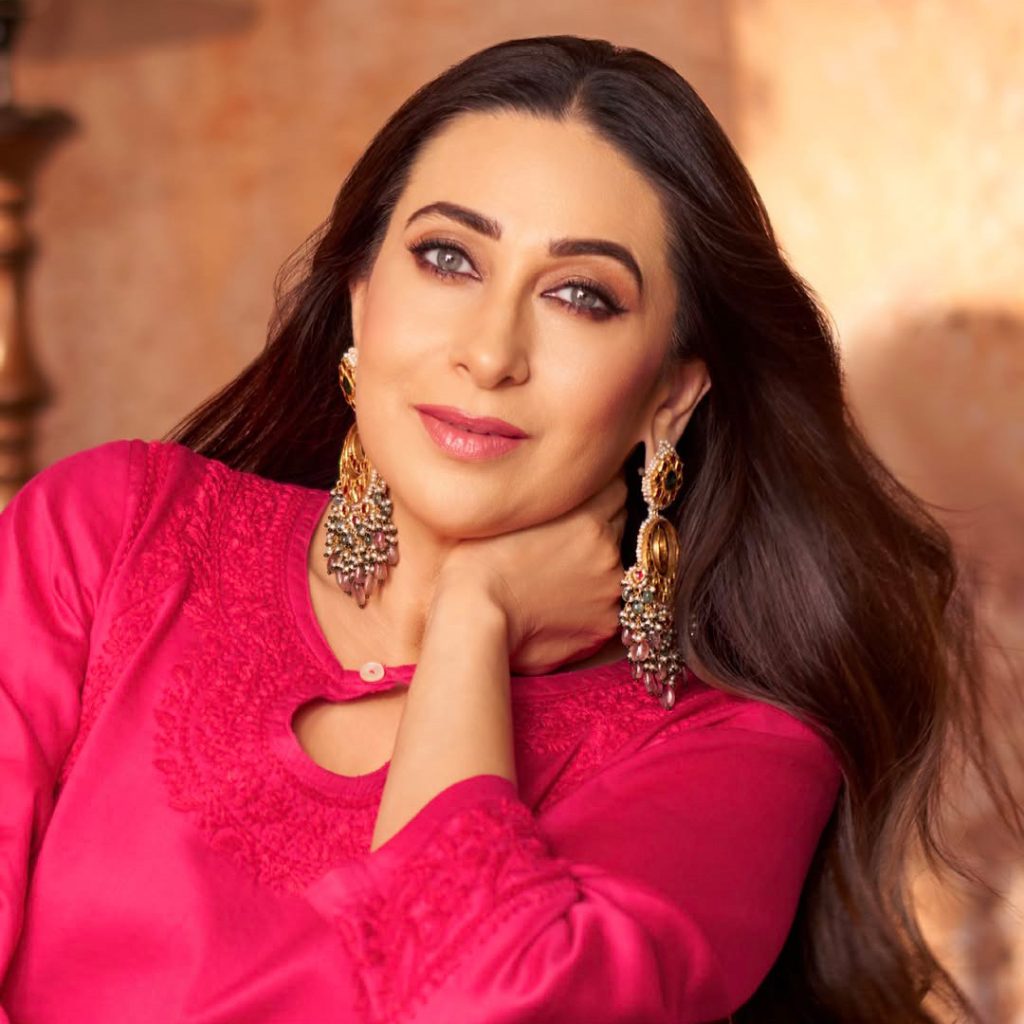 Karisma Kapoor wearing polki dangler earrings with intricate gold work by Jagdish Jewellers