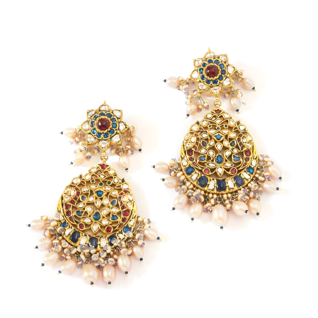 Mrunal Thakur wearing polki chandbali earrings with pearl drops and enamel ring by Jagdish Jewellers