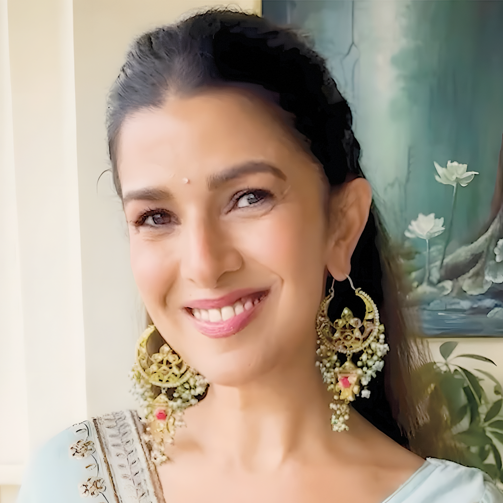 Nimrat Kaur wearing classic gold statement dangler earrings by Jagdish Jewellers