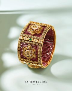 Bridal bangles with layered gold and stonework by SS Jewellers