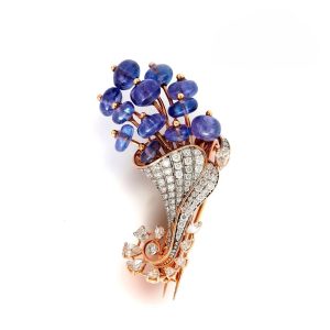 Luxury floral brooch for men in rose gold with diamonds and blue tanzanite stones by AJB Fine Jewels