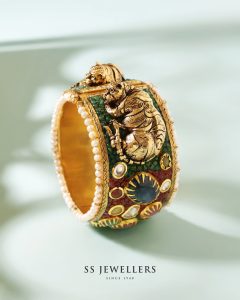 Temple-inspired gold kada with traditional motifs by SS Jewellers