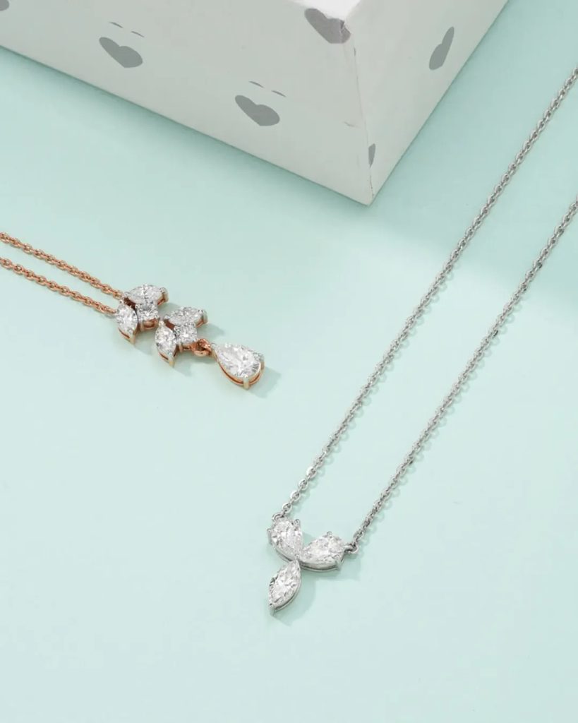 Diamond earrings by Manubhai Jewels and minimal diamond pendant by Dhirsons Jewellers for everyday wear