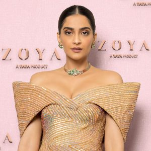 Sonam Kapoor wearing emerald diamond choker by Zoya with structured gold outfit