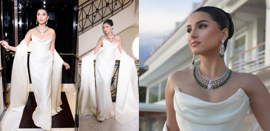 Tara Sutaria in a white sculpted gown styled with an emerald and diamond necklace set featuring matching chandelier earrings at Cannes 2026.