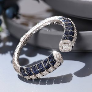 Blue sapphire and diamond cuff bracelet with structured setting by Chheda Jewellers