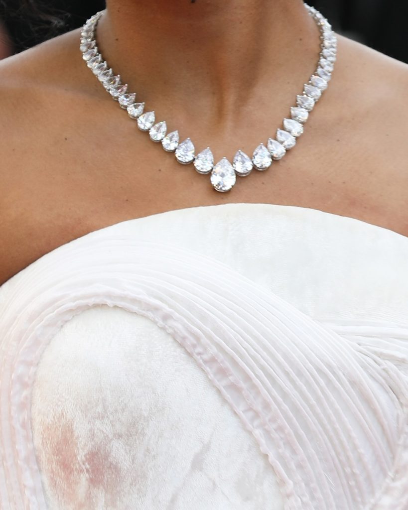 Close-up of Sennes teardrop solitaire diamond necklace worn by Rida Tharana