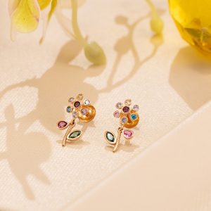 Multi colour floral gemstone stud earrings in gold by Akshaya Gold & Diamonds