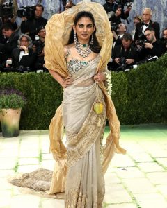 Isha Ambani wearing layered diamond, emerald, polki and kundan jewellery at Met Gala 2026
