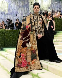 Karan Johar wearing gemstone brooches and statement mens jewellery at Met Gala 2026