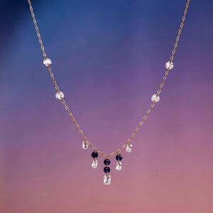 Minimal gold necklace with diamonds and gemstone accents by Akshaya Gold & Diamonds
