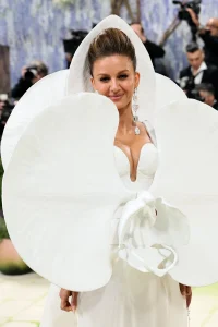 Natasha Poonawalla wearing dramatic mismatched diamond earrings at Met Gala 2026