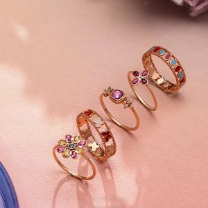 Stackable gold rings with coloured stones and enamel detailing by Akshaya Gold & Diamonds