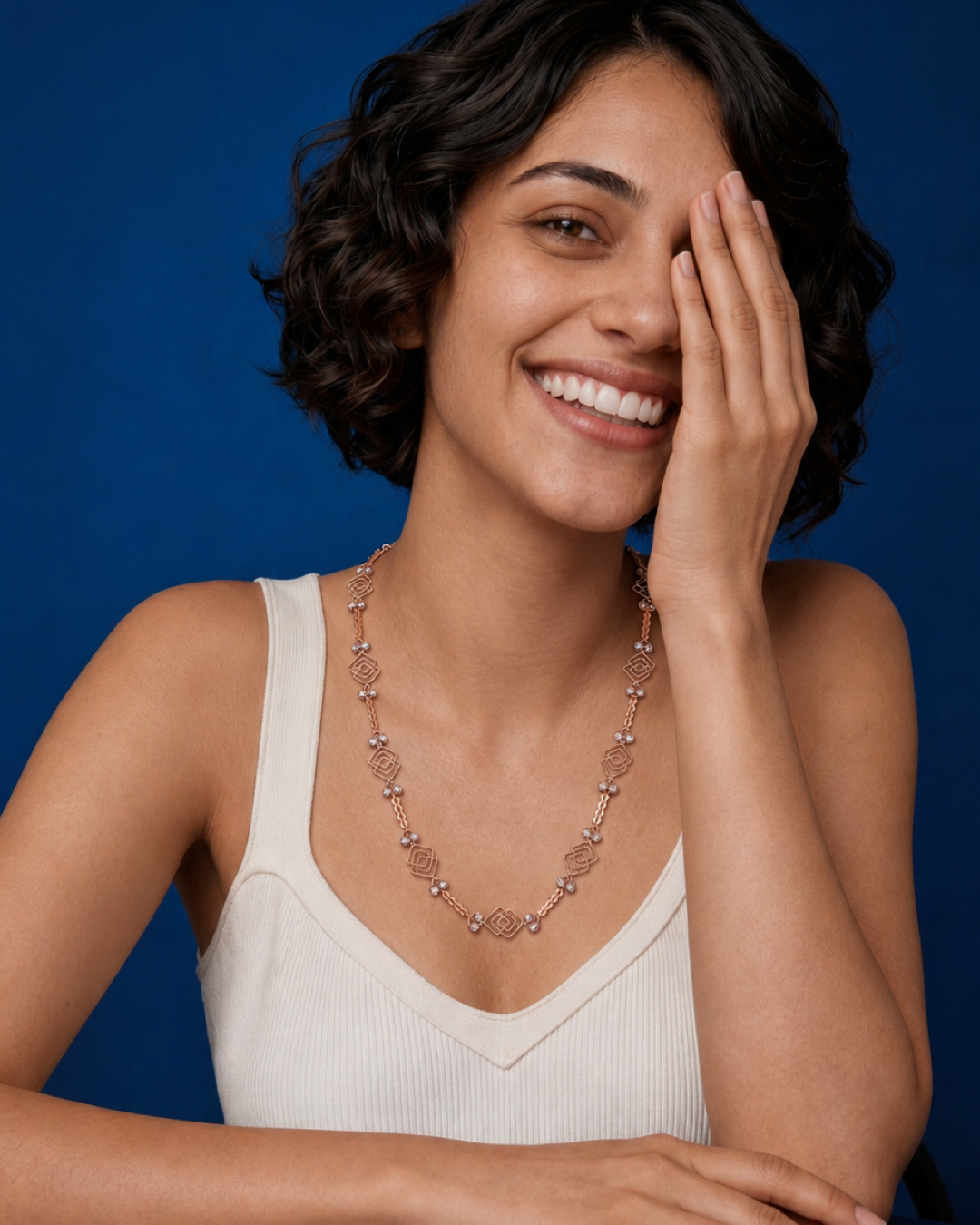 18KT rose gold geometric necklace with delicate bead accents and contemporary openwork design by Manubhai Jewels