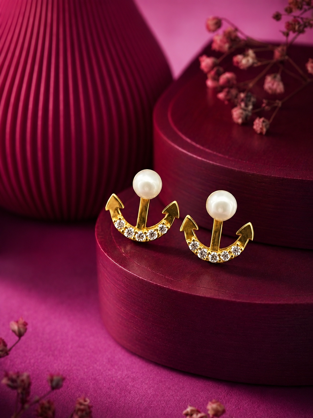 Pearl and diamond accent gold earrings with anchor-inspired motif from Sanya Fine Jewellery by Abaran