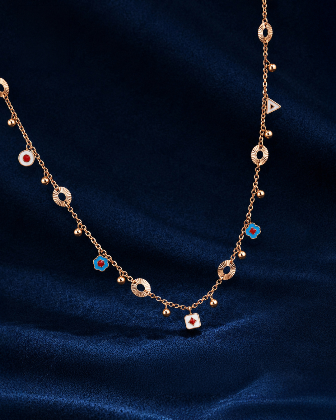 18KT rose gold charm necklace with colourful enamel motifs and geometric details by Manubhai Jewels