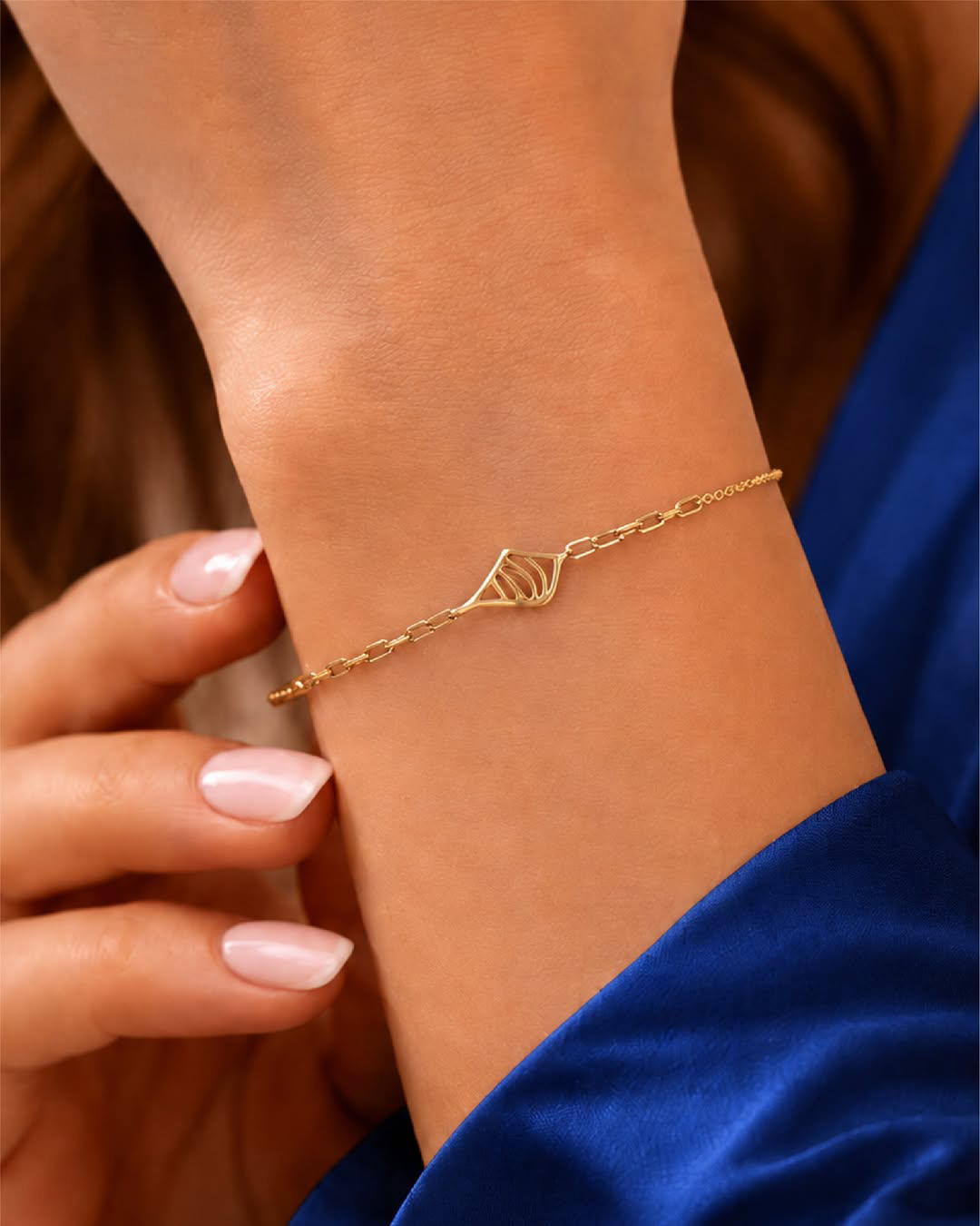 18KT yellow gold bracelet with elegant openwork centre motif and minimalist chain design by Manubhai Jewels