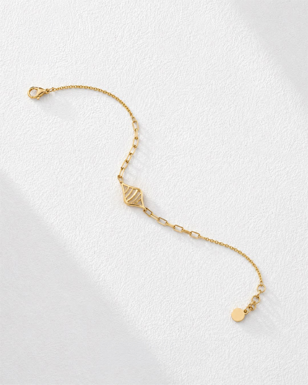 18KT yellow gold bracelet with elegant openwork centre motif and minimalist chain design by Manubhai Jewels
