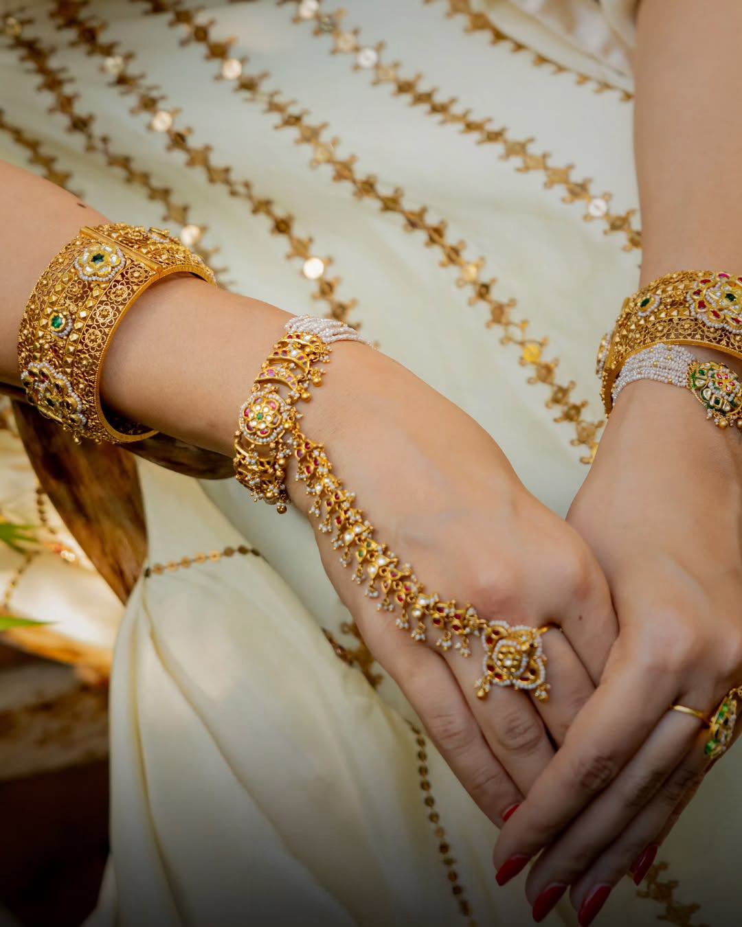 Traditional bridal haathphool by Suvarnam Jewels featuring pearls, gold motifs, and intricate Indian jewellery craftsmanship