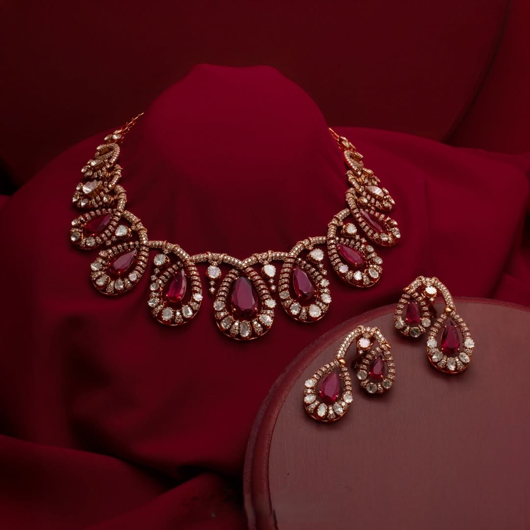 Ruby and diamond statement necklace with matching drop earrings by AabushanJewellery1941 for bridal and festive wear.