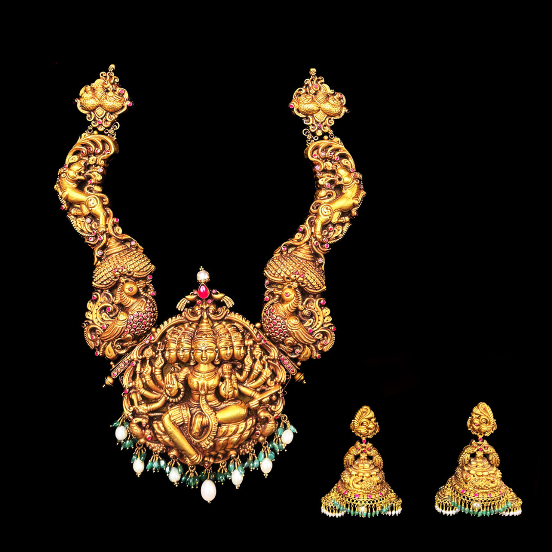 Aabushan Jewels The Divine Story temple-inspired gold bridal necklace with peacock motifs and matching earrings